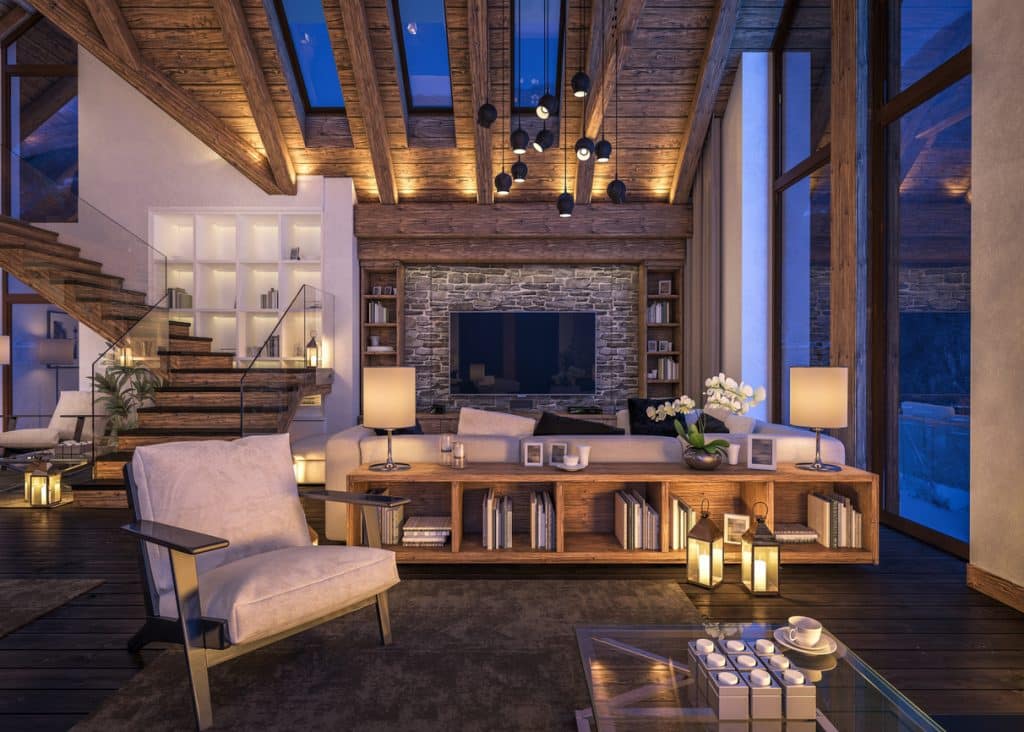 3D rendering of cozy living room on cold winter night in the mountains, evening interior of chalet decorated with candles, fireplace fills the room with warmth.